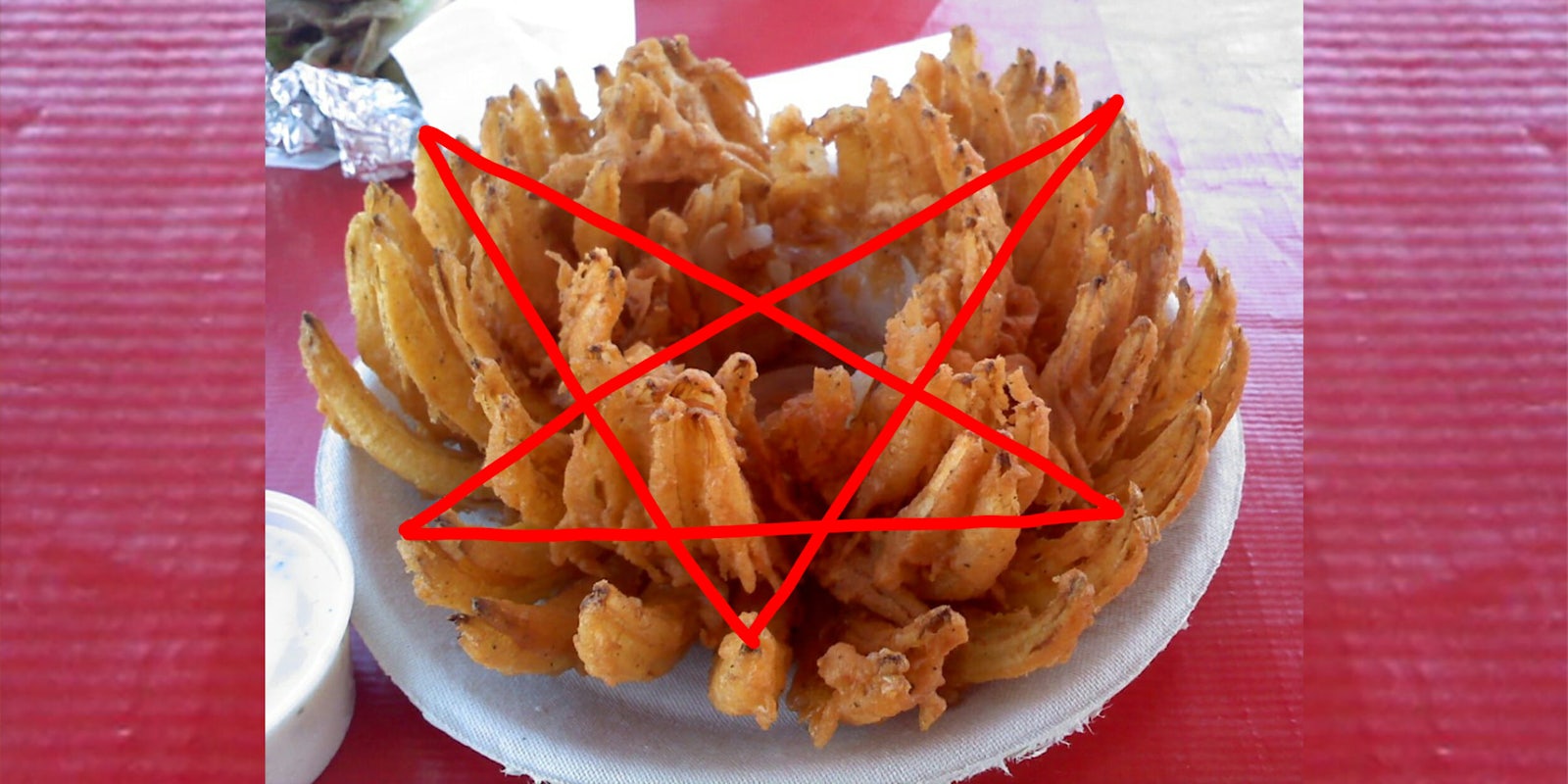 Pentagram drawn in red on picture of an Outback Steakhouse 'Blooming Onion'