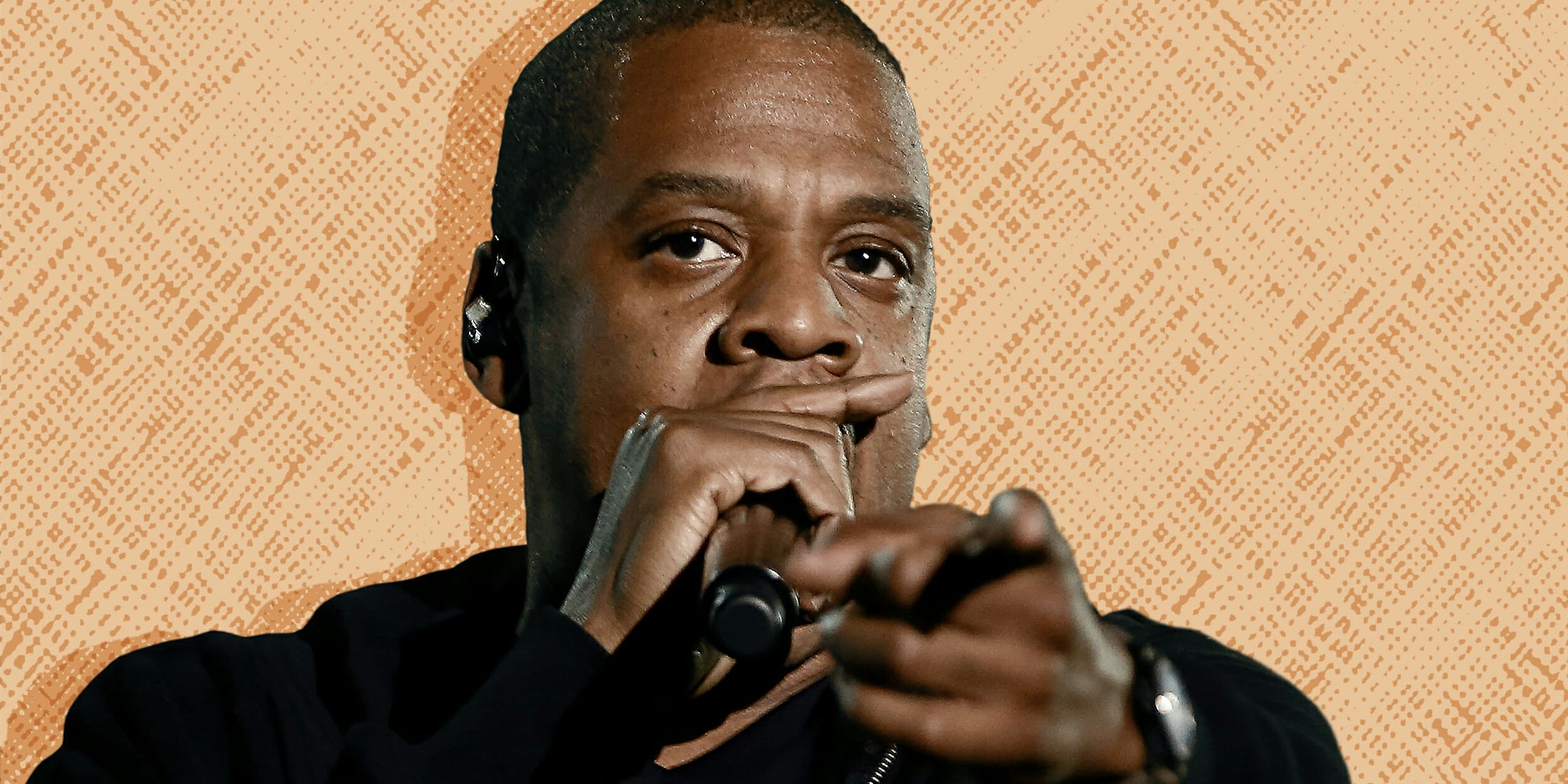 Jay-Z performing and pointing to the camera