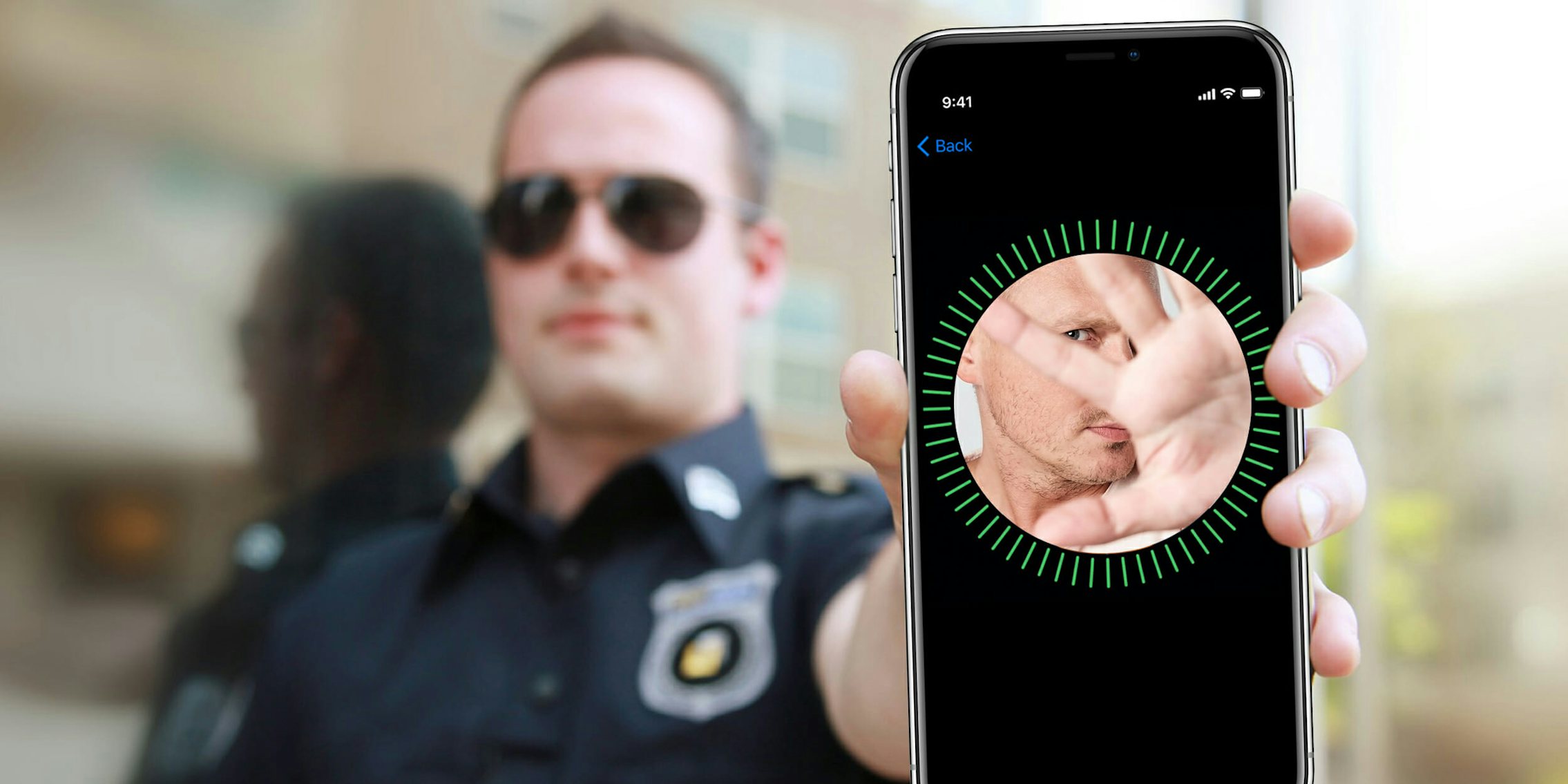 Police officer holding iPhone X with unlock screen