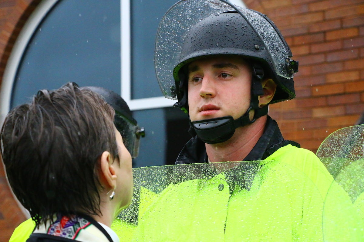 Ferguson October: police officer and protester