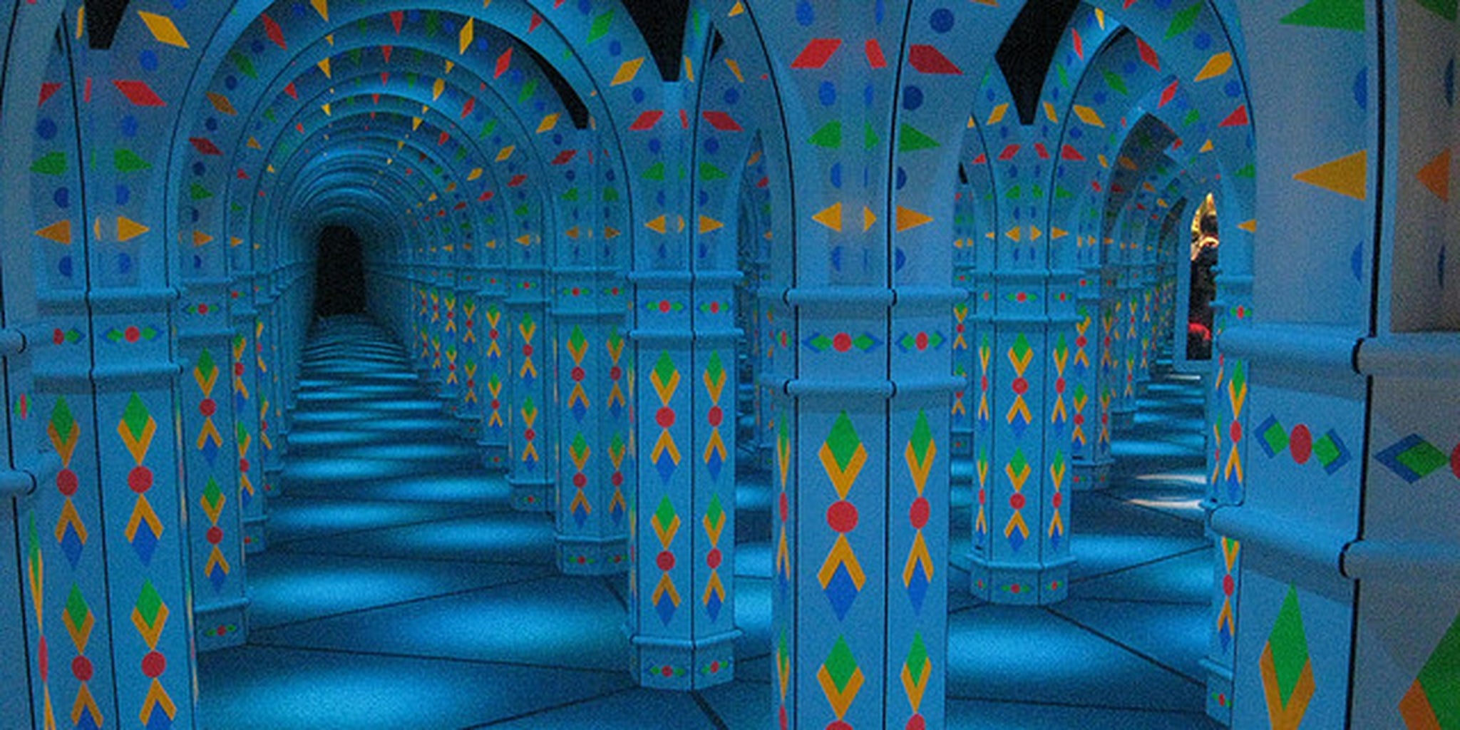 Exuberant young child learns why you don't run through mirror mazes