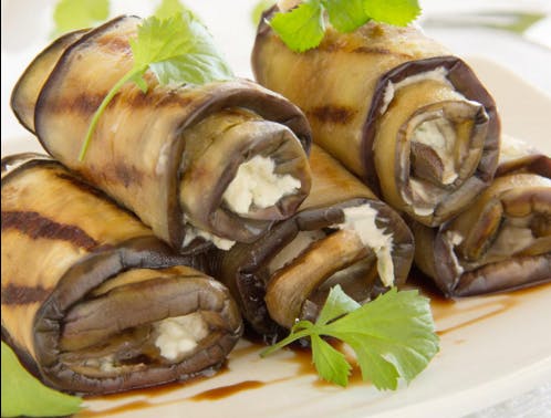 Spinach and ricotta cheese stuffed eggplant roulade