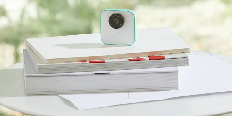 Google Clips sitting atop books
