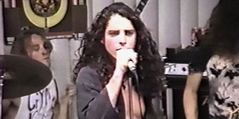 young Chris Cornell performing in a record store