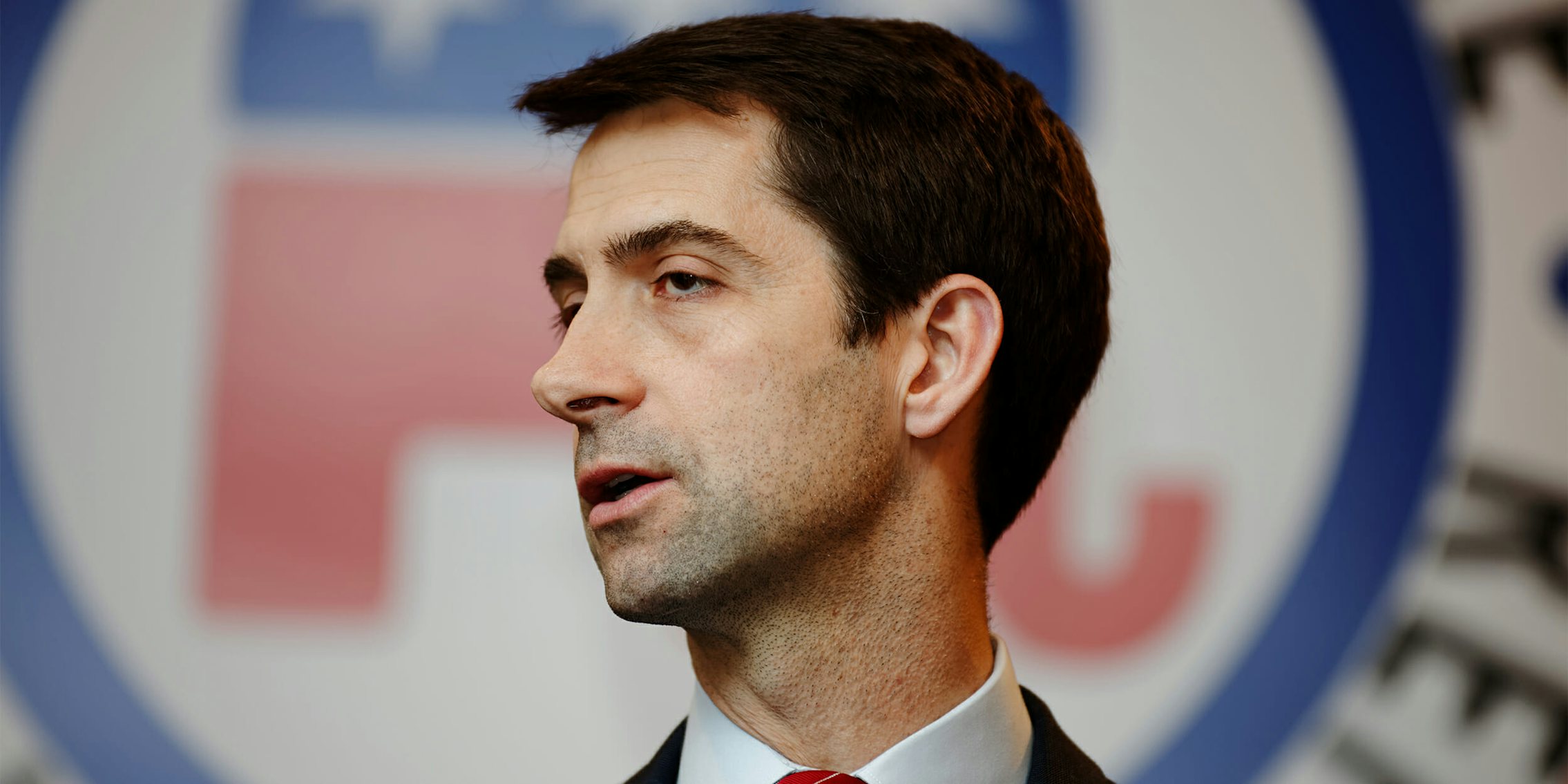 Tom Cotton in front of GOP logo