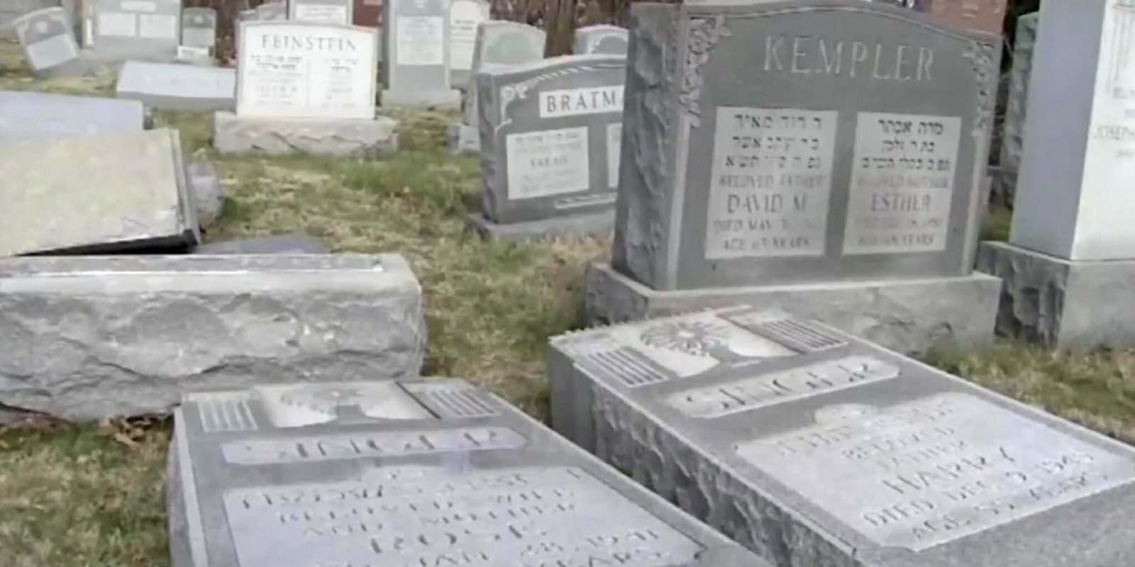 Vandalized grave markers in a Jewish cemetery.