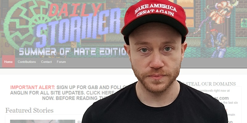 Andrew Anglin in front of Daily Stormer website