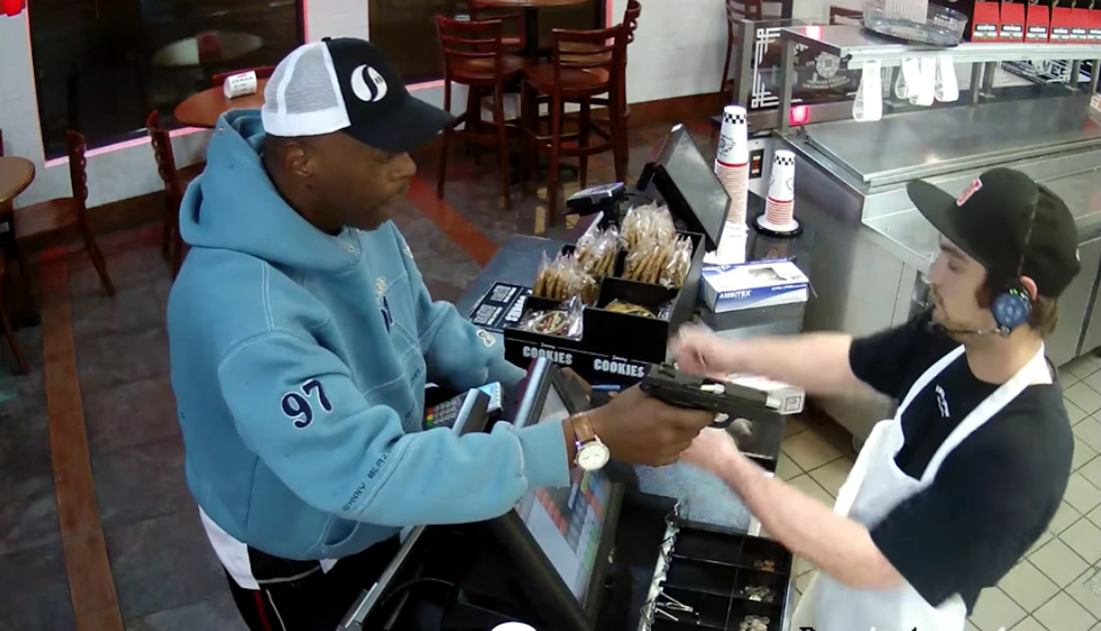 jimmy john's robbery video: cashier unfazed by robber's handgun