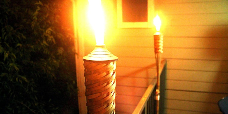 Flaming Tiki torches on porch