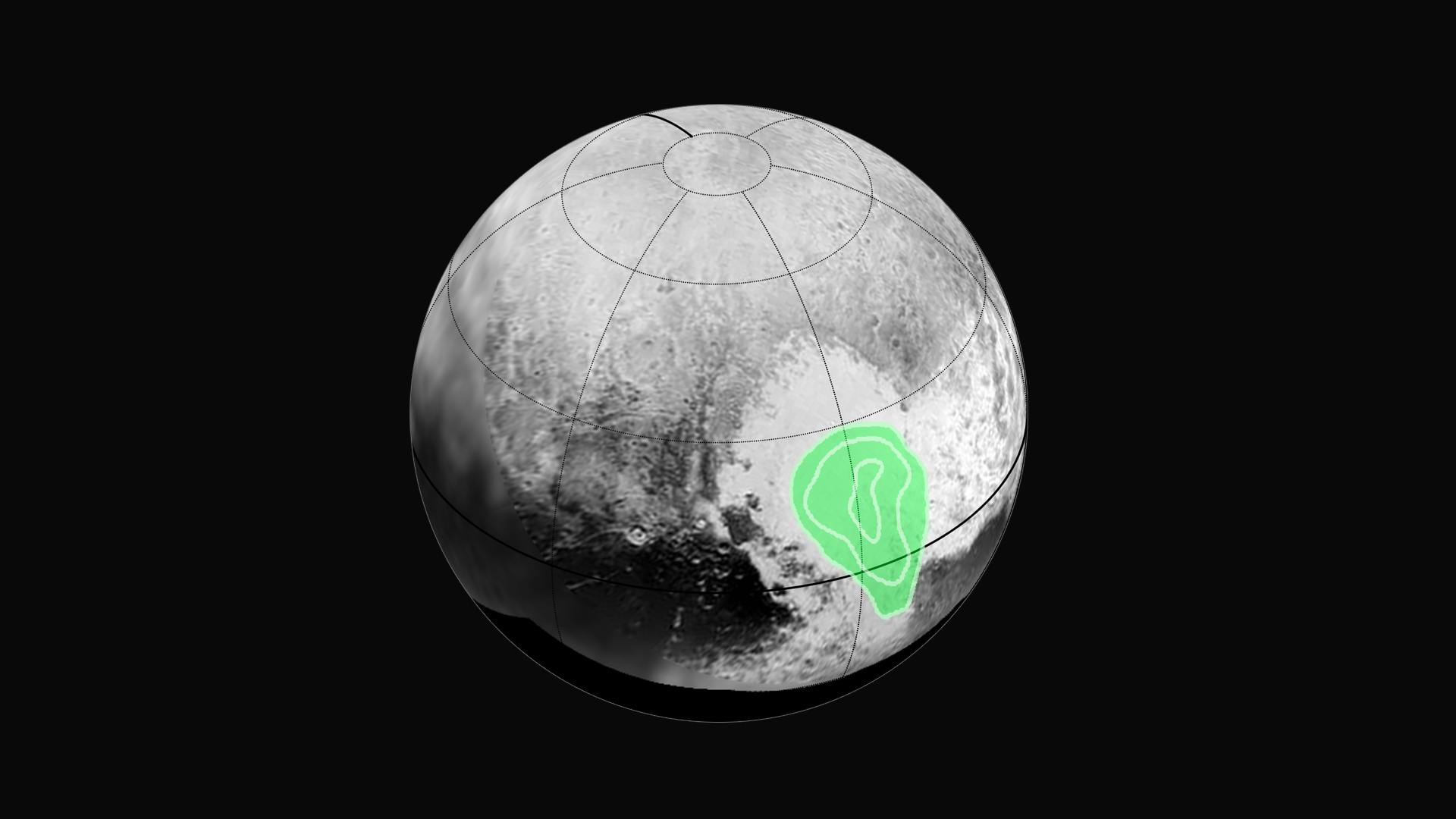 NASA shows frozen carbon monoxide layer in Pluto's "heart" highlighted in green.