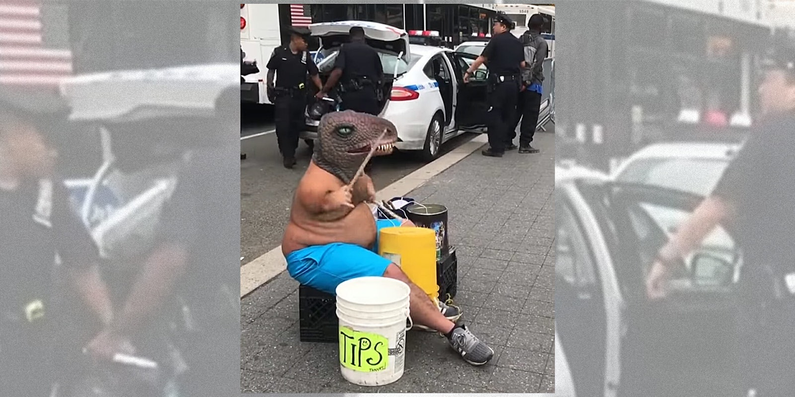 Man in T-Rex mask playing drums near NYPD arrest