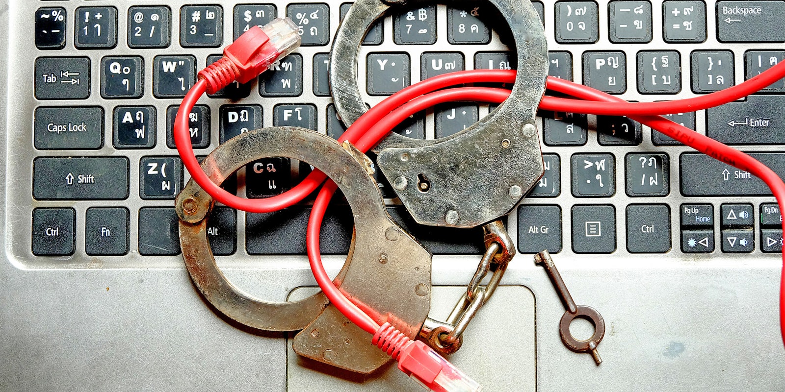 Handcuffs on ethernet cables on keyboard CLOUD Act