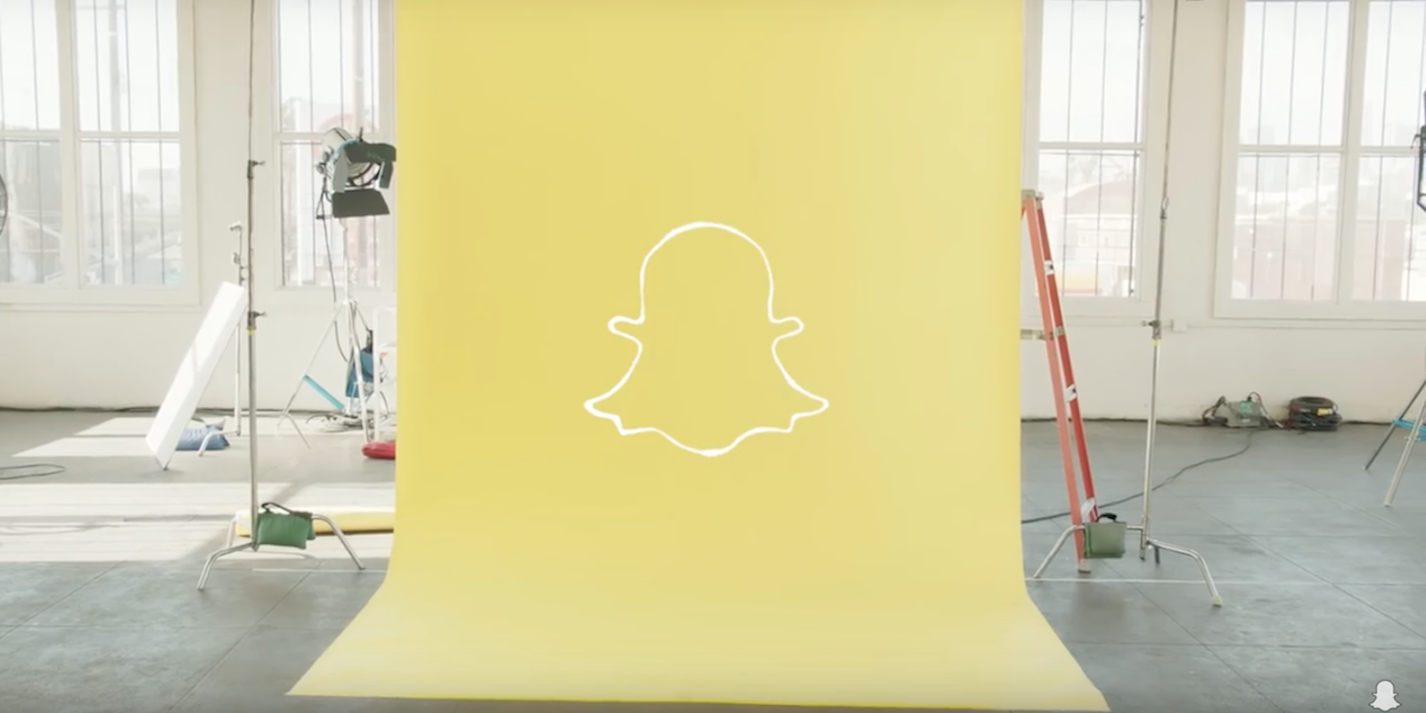 Snapchat ghost logo on yellow background