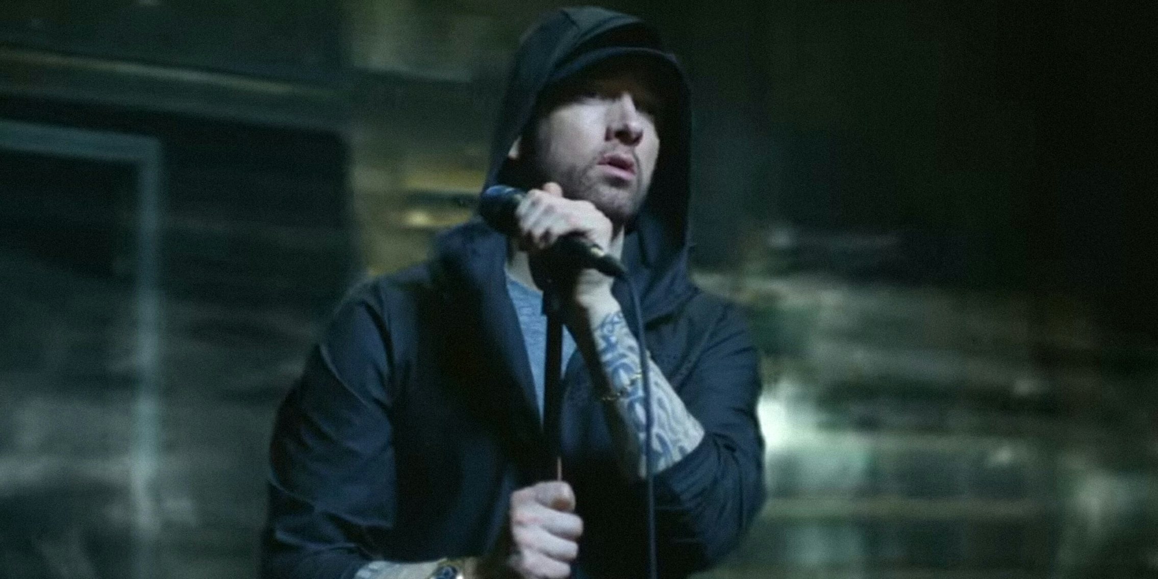 Eminem holding microphone