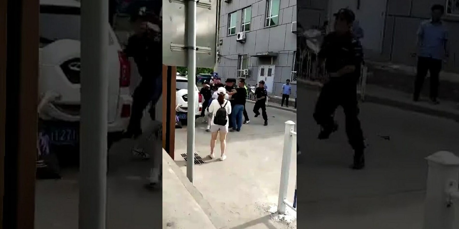 Two women wearing rainbow badges were reportedly beaten in Beijing by security guards.