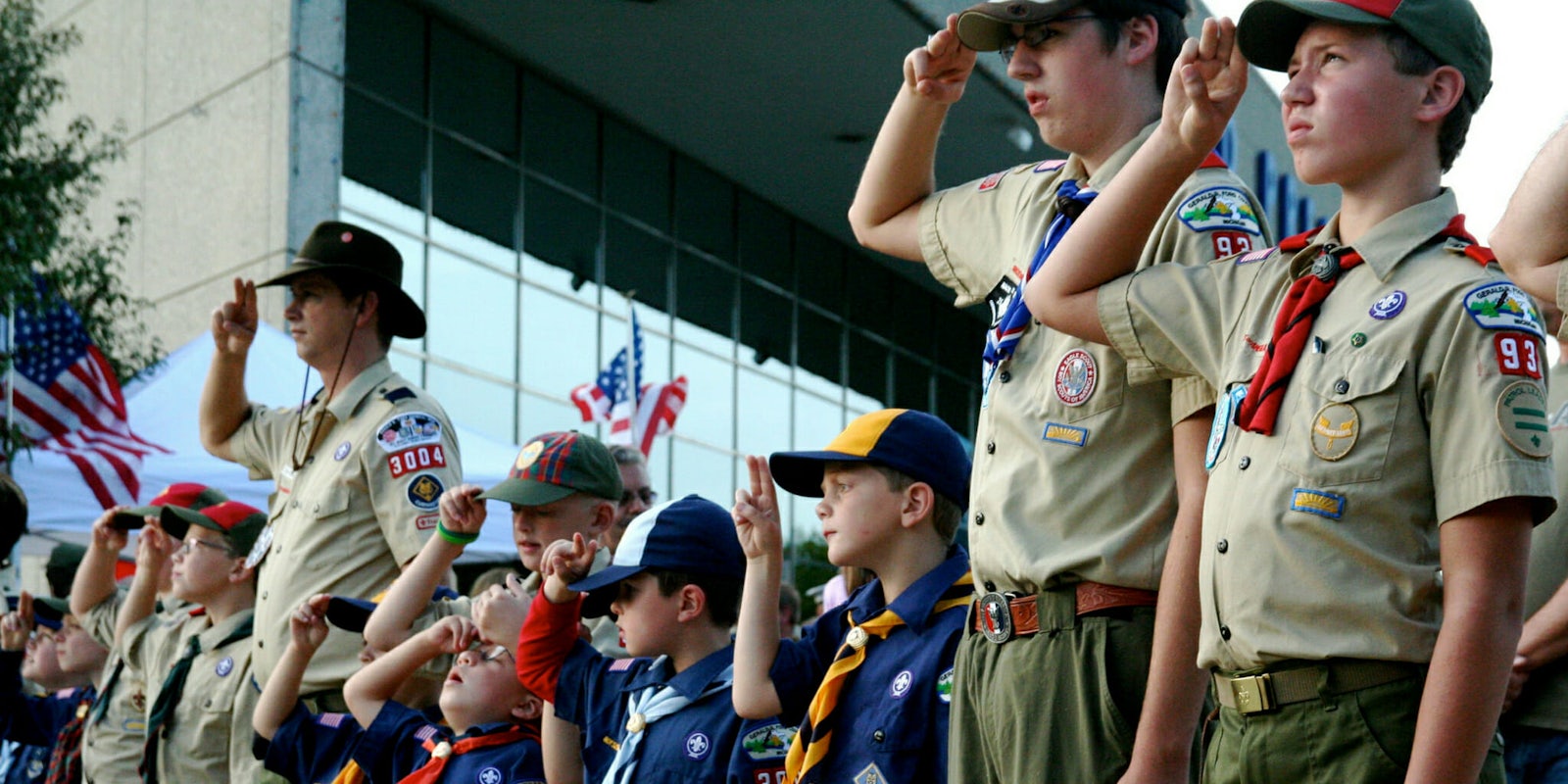 Boy Scout saluting a flag at the Gerald R. Ford Museum.