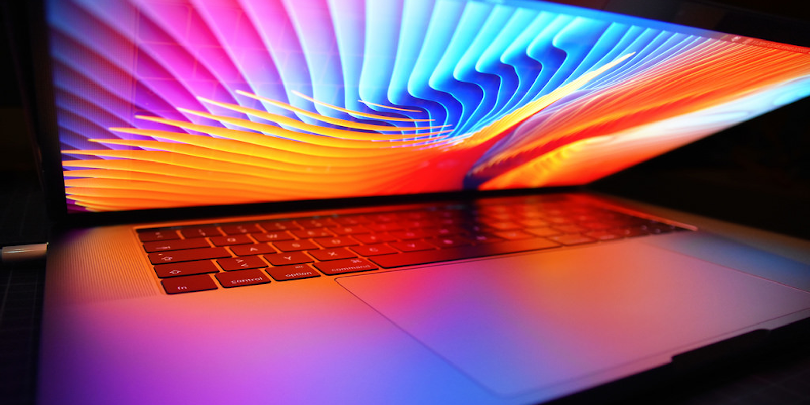 Apple laptop with colors onscreen