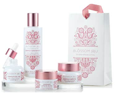 Korean brand Blossom Jeju packaging with beautiful pink flowers on white