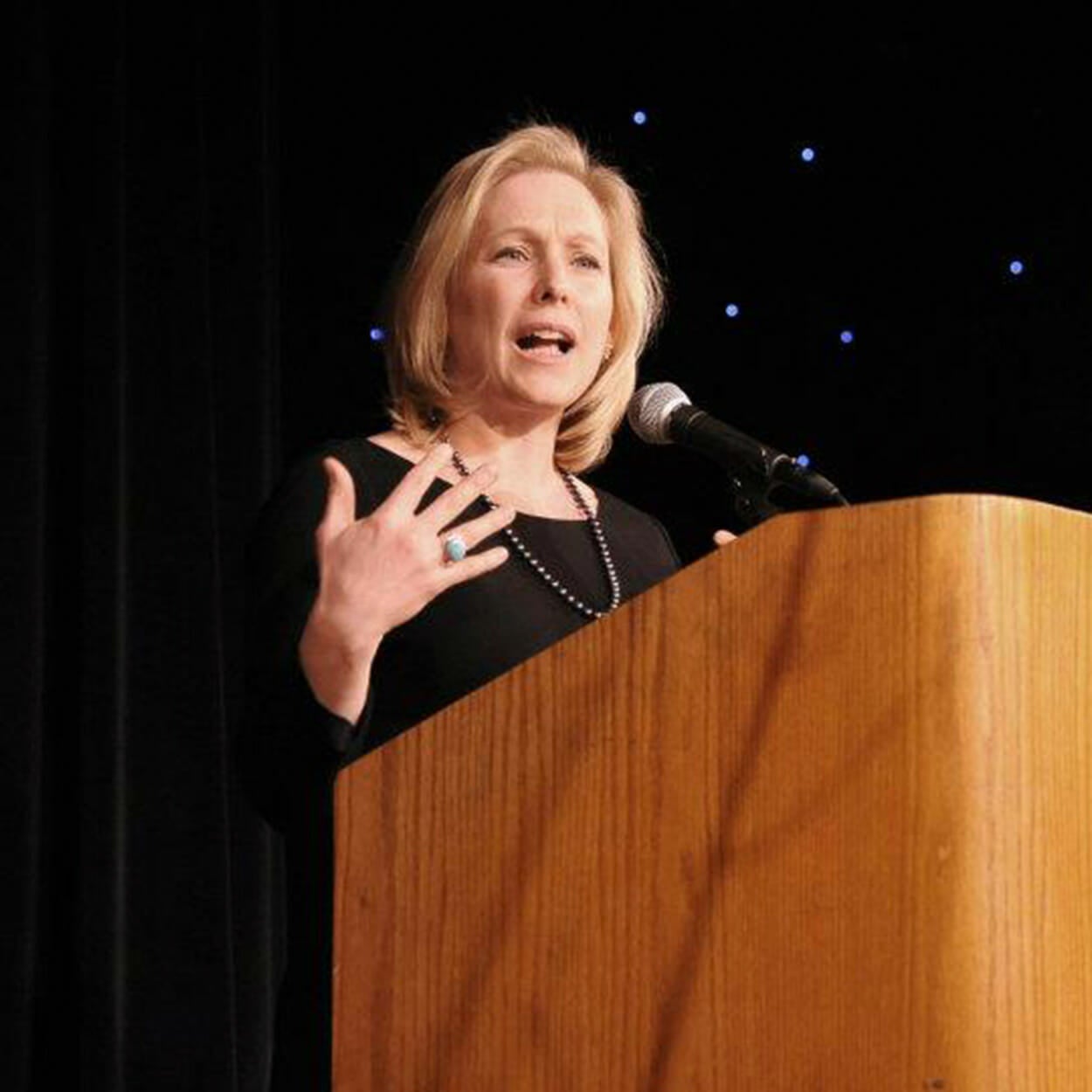 Kirsten Gillibrand talking at a podium.