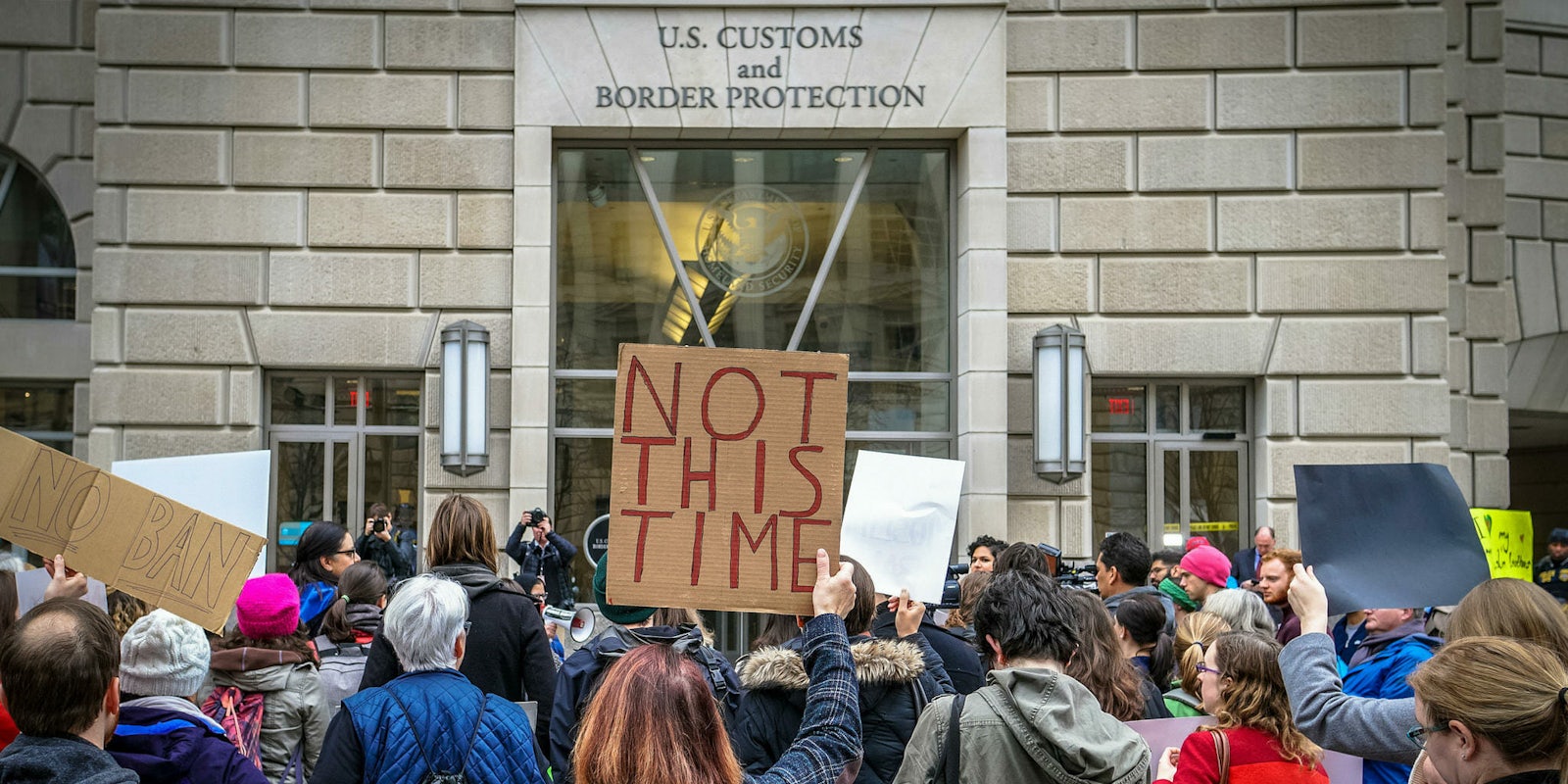 People protesting a U.S. Customs and Border Protection office.