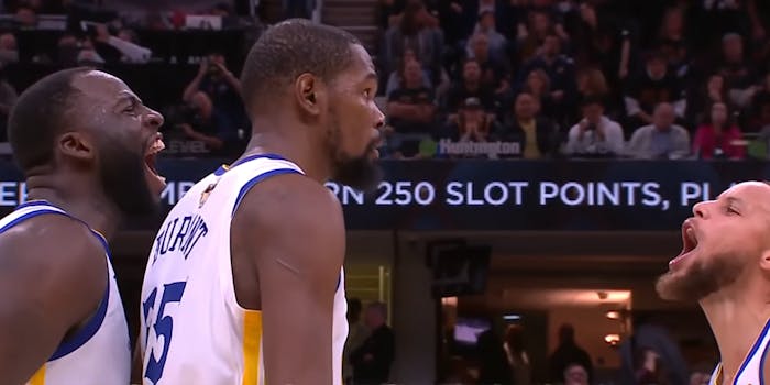 draymond green and stephen curry celebrate around kevin durant at game three of the nba finals