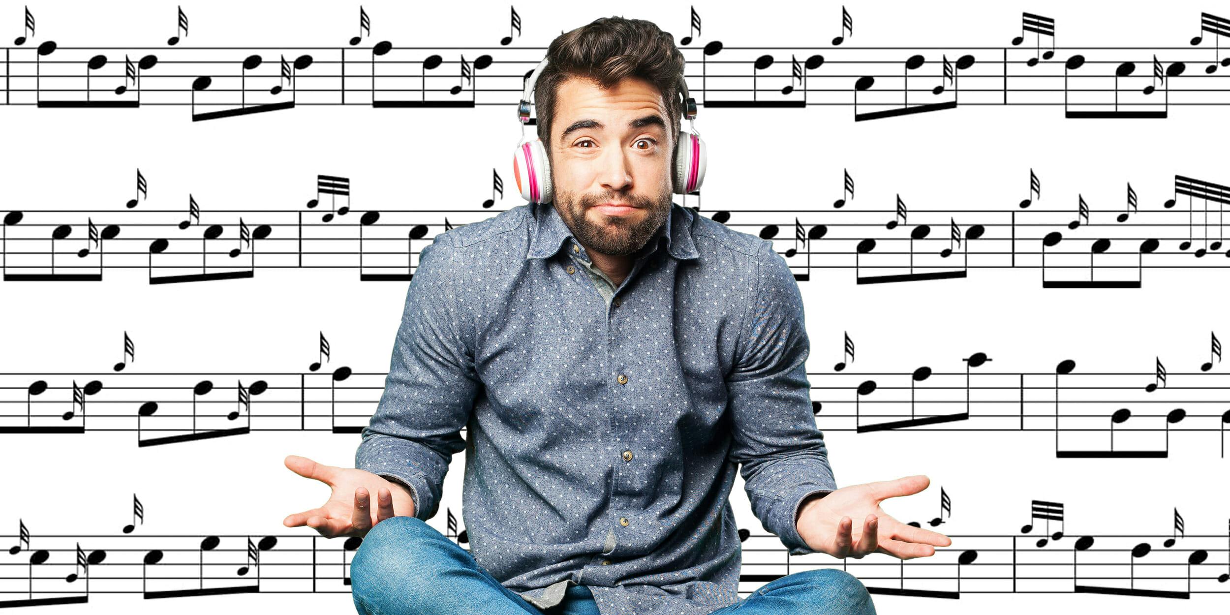 man with headphones shrugging in front of sheet music