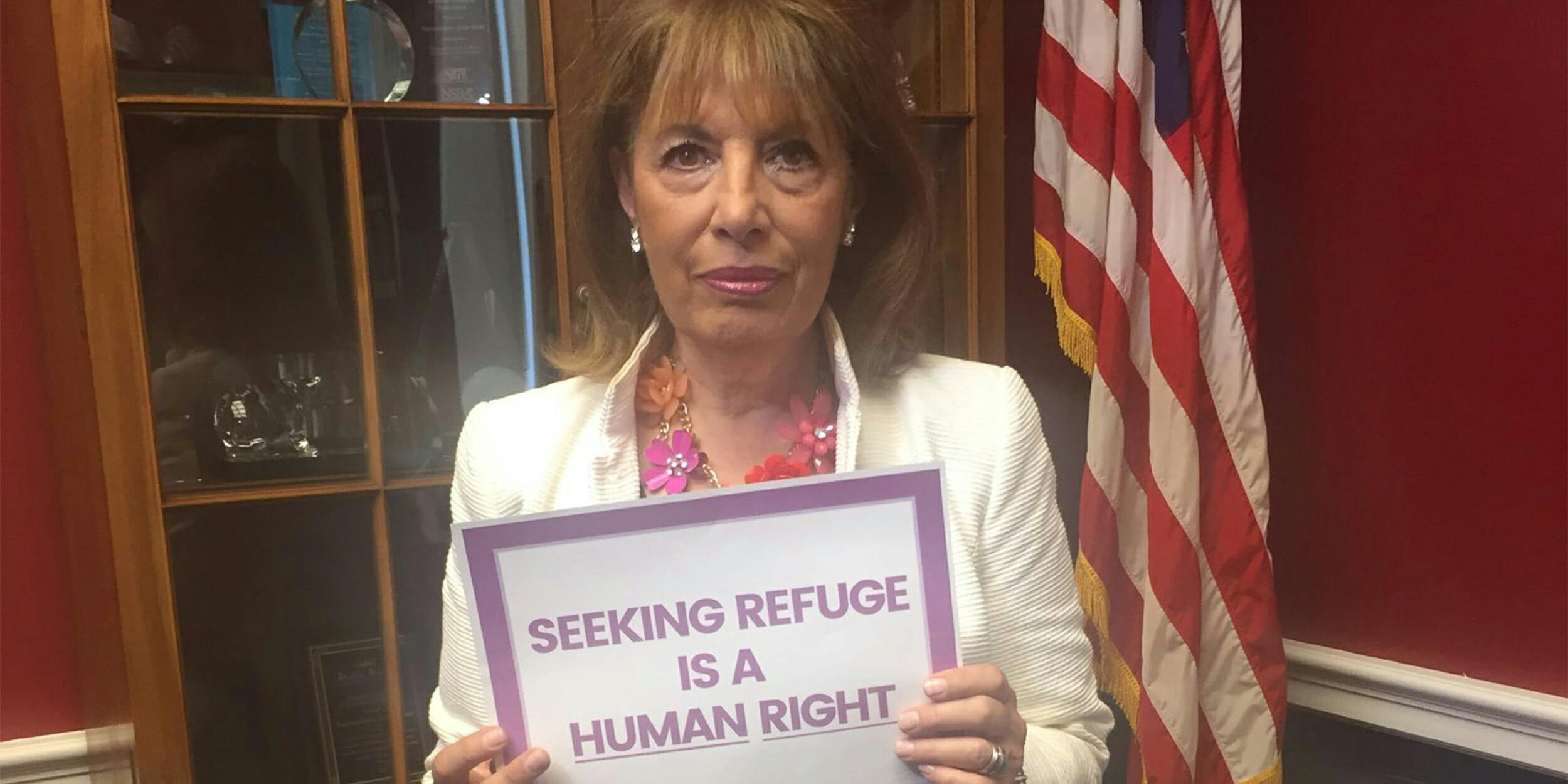 Rep. Jackie Speier holding "Seeking refuge is a human right" sign
