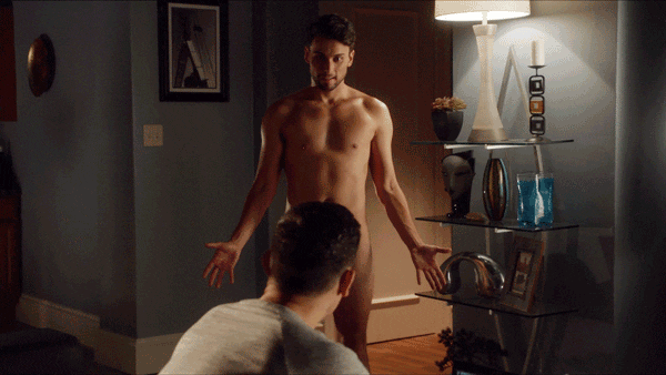 Animated gif of a man standing naked with another man's head blocking his private parts from the camera. From the reddit nsfw gay gifs