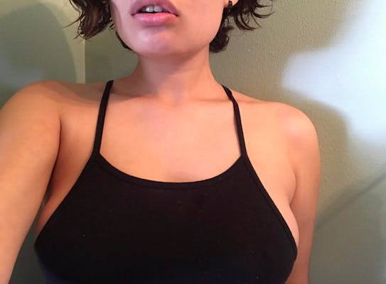 Photo with a close up of a woman's chest in a tank top from the real girls subreddit