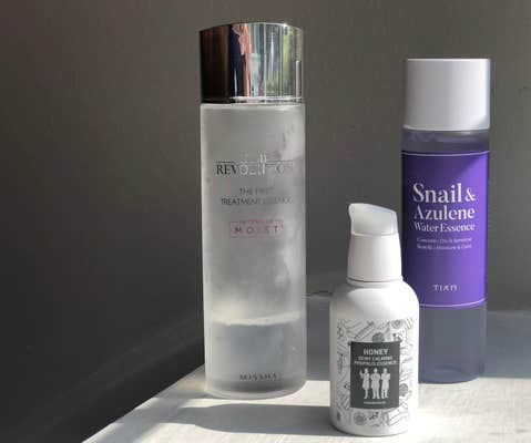 Three essence bottles standing on a shelf