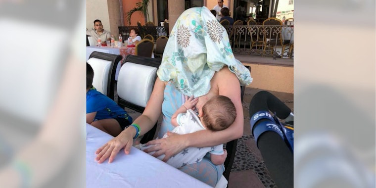 A mom was asked to 'cover up' while breastfeeding her baby—so she covered her own head.