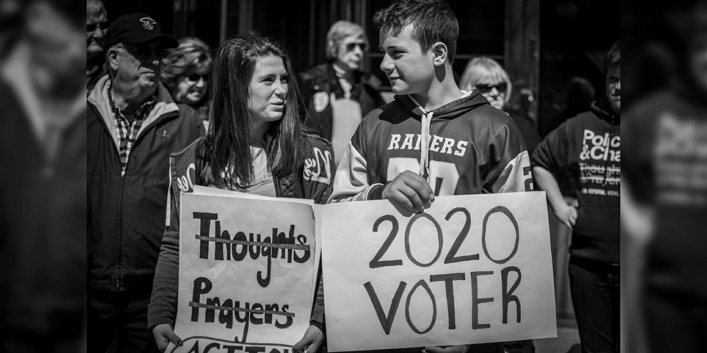 March for our Lives protesters holding a '2020 Voter' sign in Washington, D.C.
