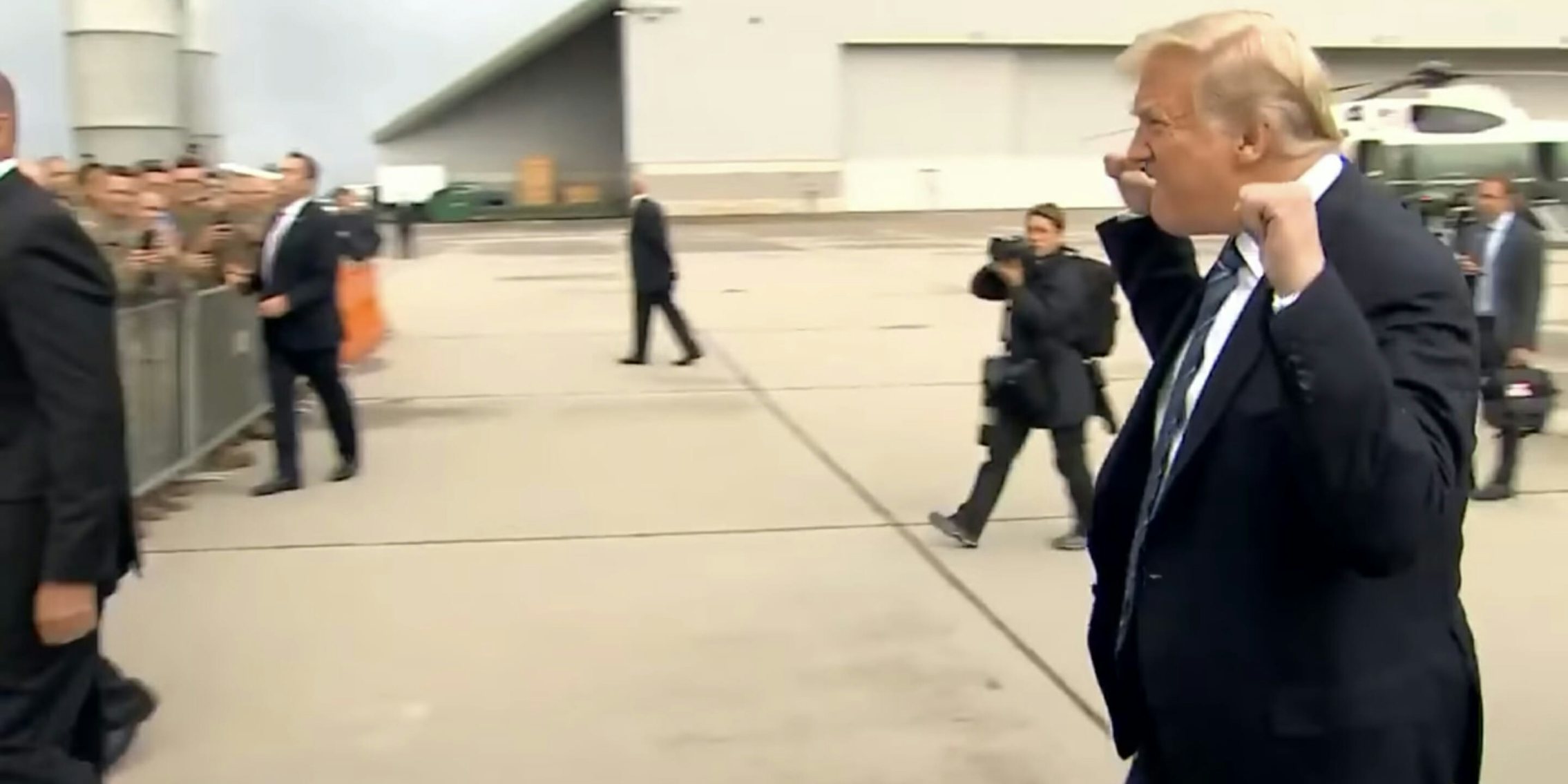 Trump fist pumps as he walks toward the crowd at a 9/11 memorial service.