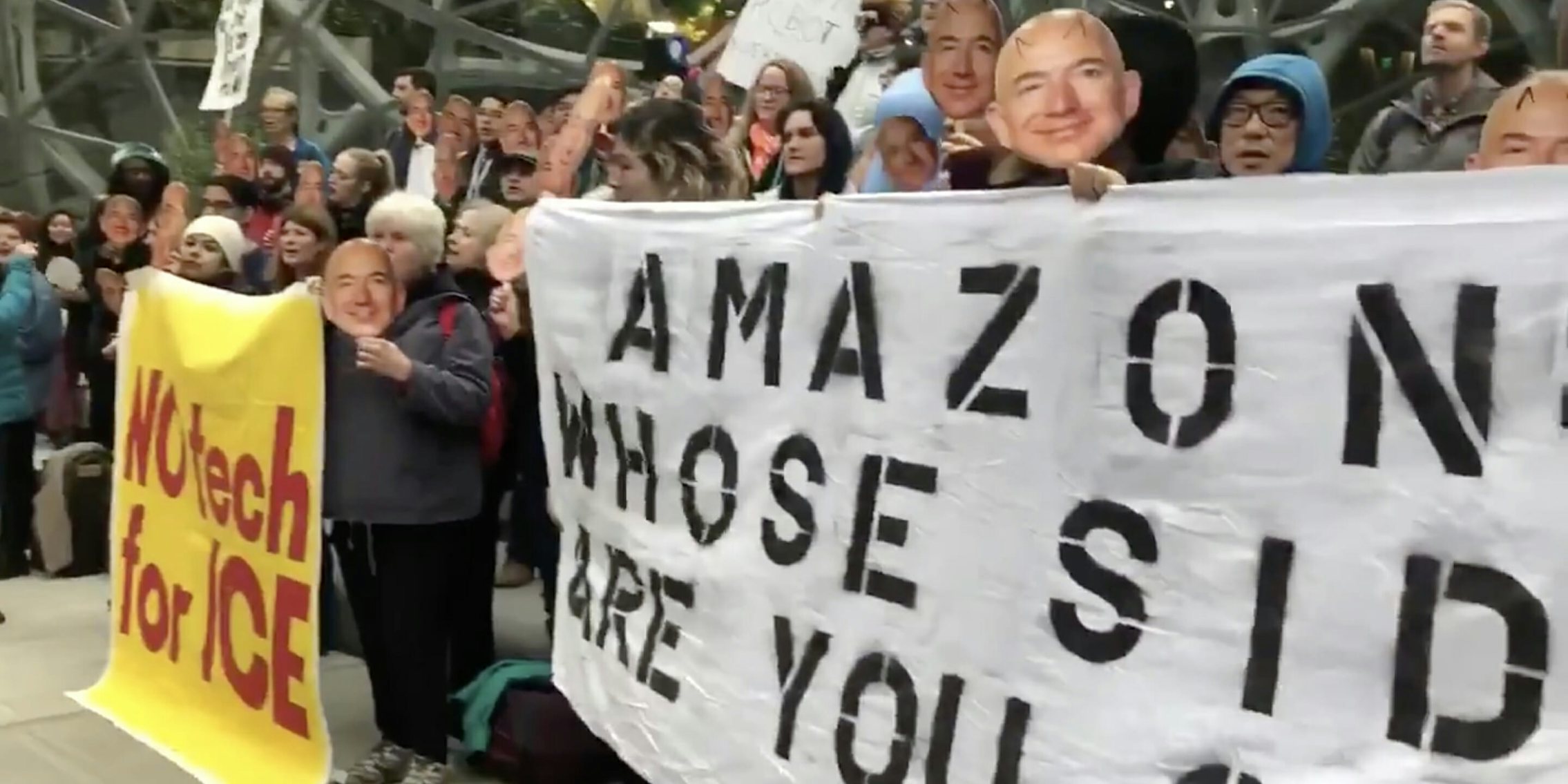 Protesters with Jeff Bezos masks protested Amazon's alleged sales pitch of its facial recognition technology to Immigration and Customs Enforcement.