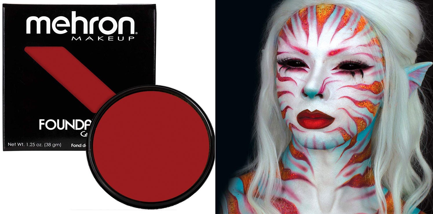 Woman with face fully painted in white with orange tiger stripes with best halloween makeup Mehron