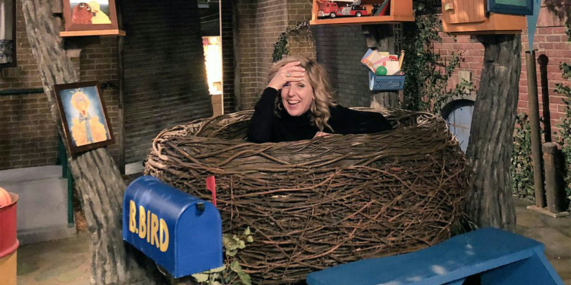 woman in big birds nest