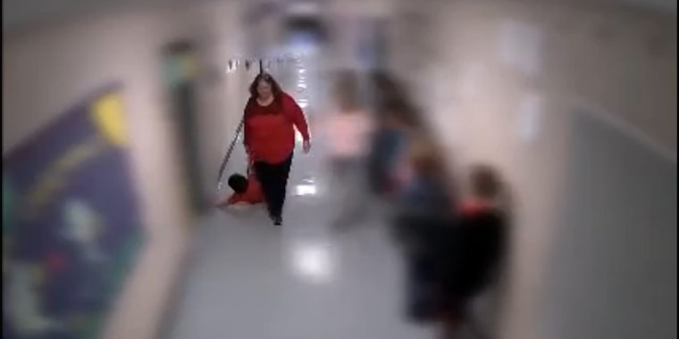 teacher dragging student