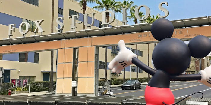 mickey mouse in front of fox studios entrance