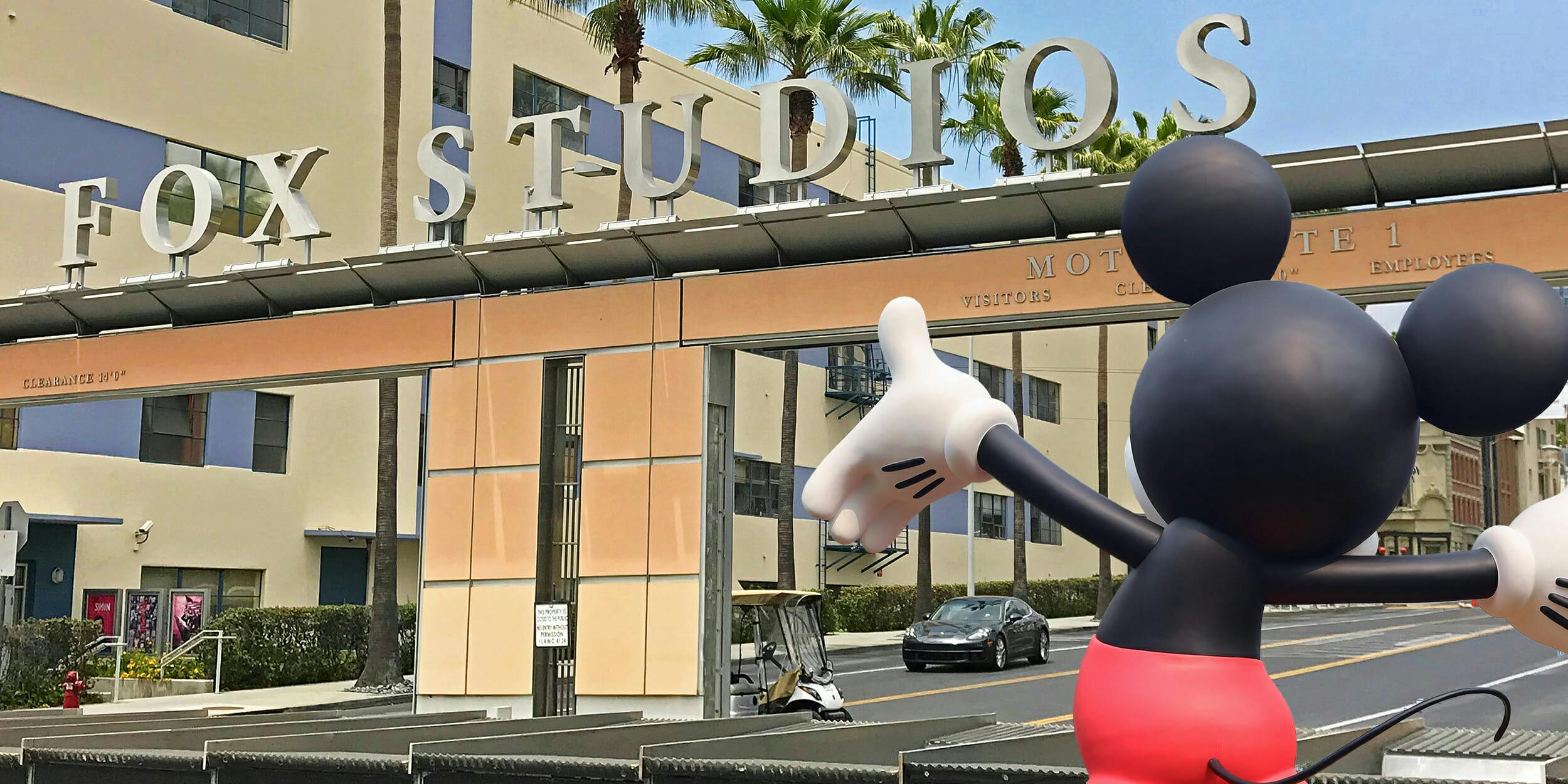 mickey mouse in front of fox studios entrance
