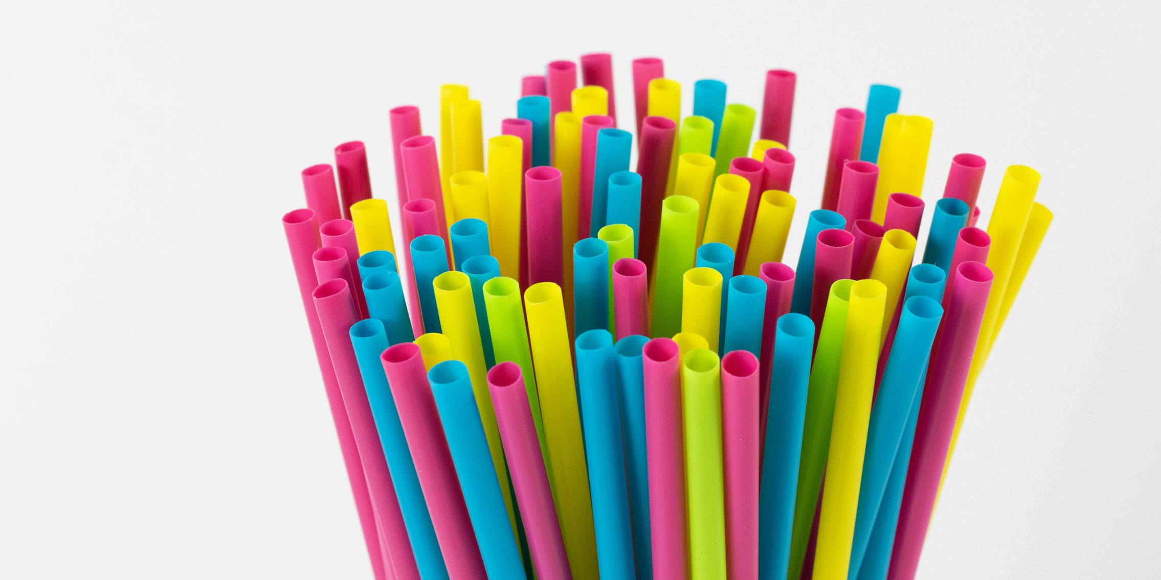 A stack of colorful plastic straws