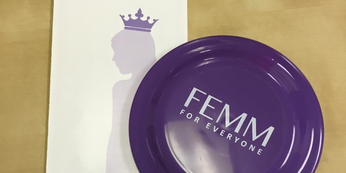A purple FEMM badge rests atop a FEMM booklet