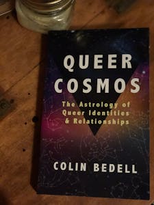 Cover of the book "Queer Cosmos: The Astrology of Queer Identities and Relationships" by Colin Bedell. 
