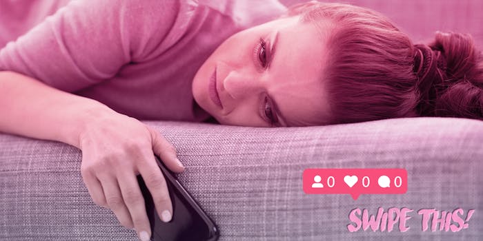 sad woman on couch holding phone