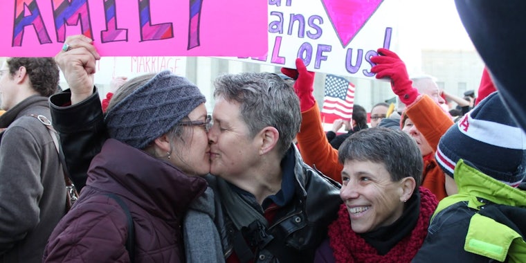 Two women are seen kissing at a Marriage Equality rally at the US Supreme Court in 2013