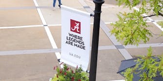 A University of Alabama flag reads 'Where legends are made'