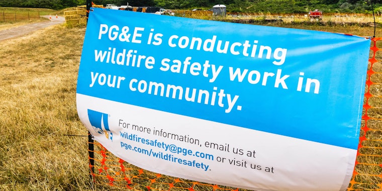 'pg&e is conducting wildfire safety work in your community' sign on construction fencing