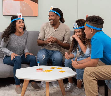 Family playing headbanz during the holidays