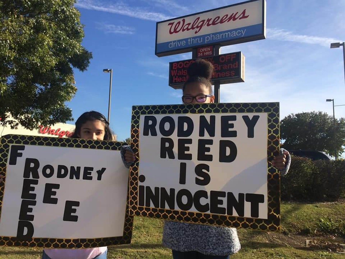 Protesters hold placards claiming Rodney Reed's innocence