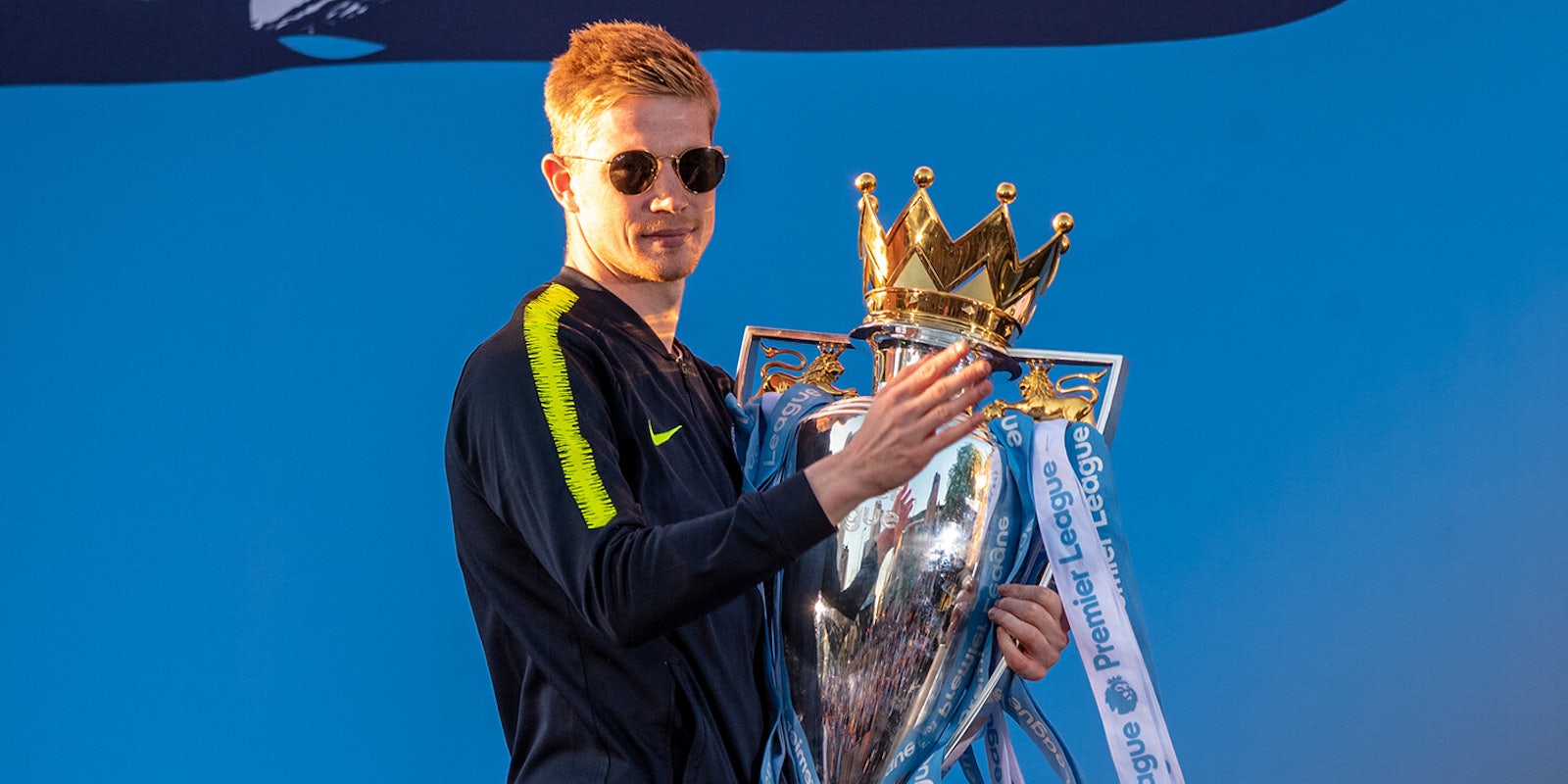 Manchester City player with Premier League trophy