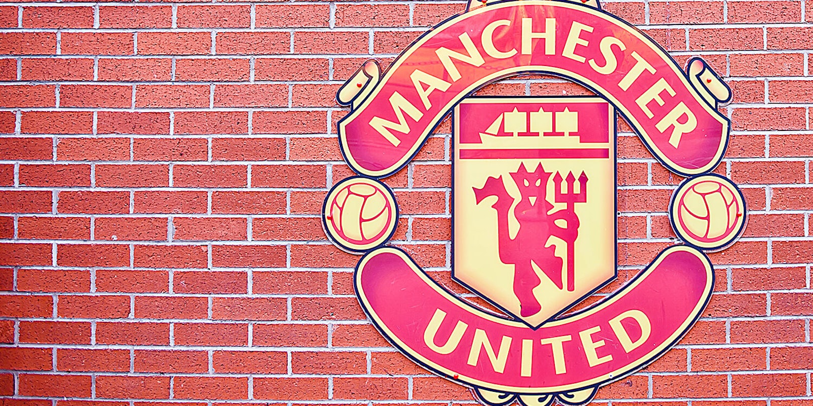 Manchester United logo at Old Trafford